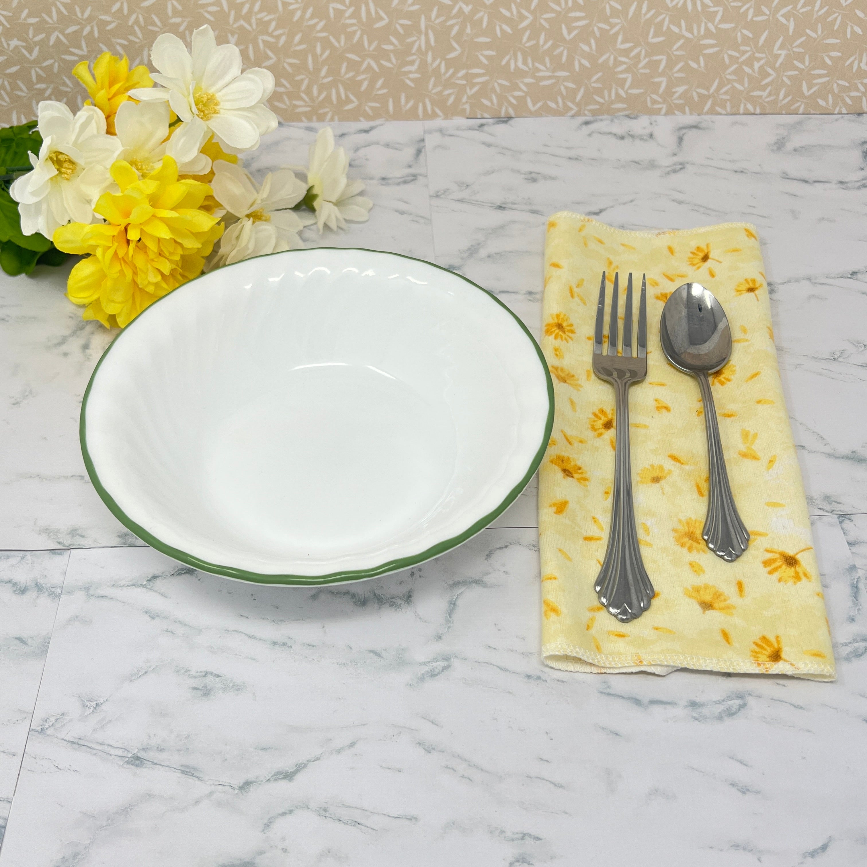 Flannel reusable paper towels. This pictures shows possible use as a paper napkin alternative in a table place setting.  Cotton fabric has yellow and gold dandelions  on a soft yellow background